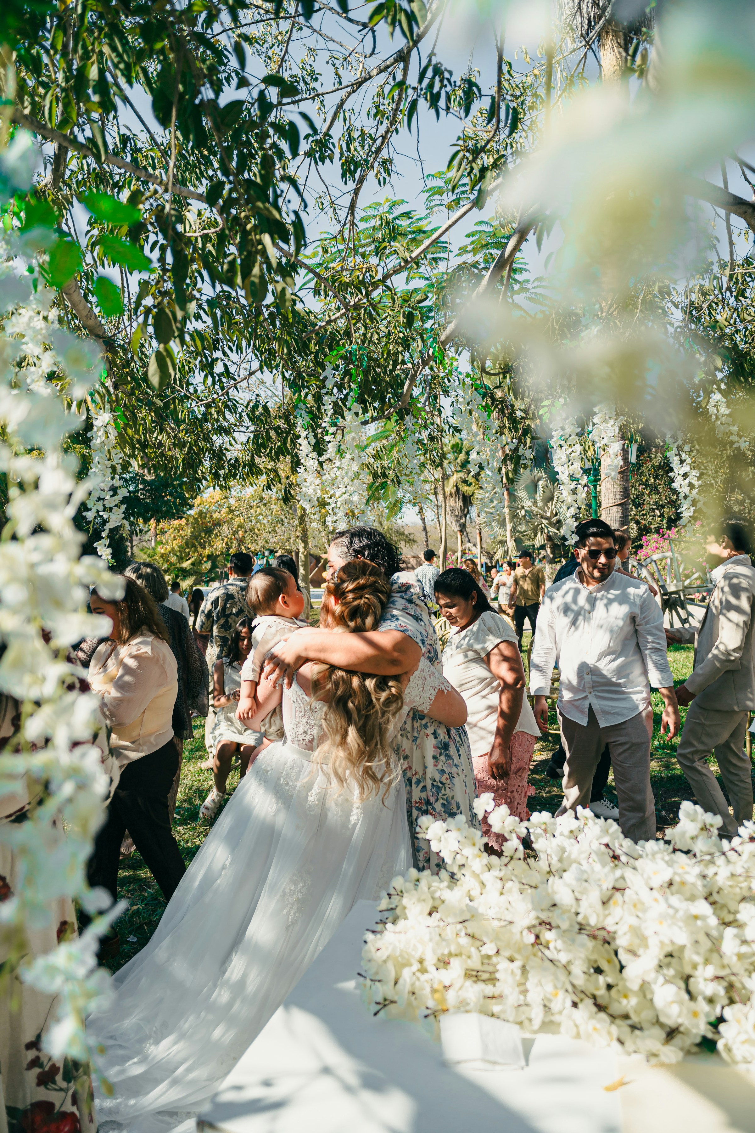 A bride sharing a natural moment with a young wedding guest